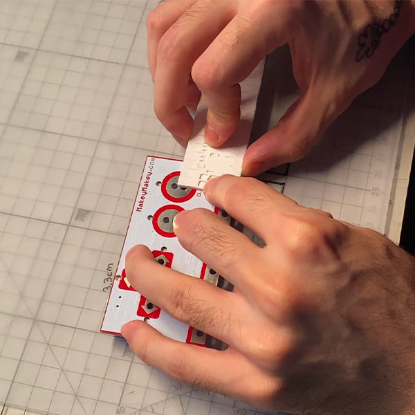 Measuring the Makey Makey for the housing.